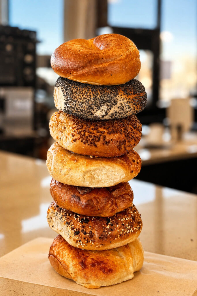 Stack of assorted New York Bagel Co. bagels