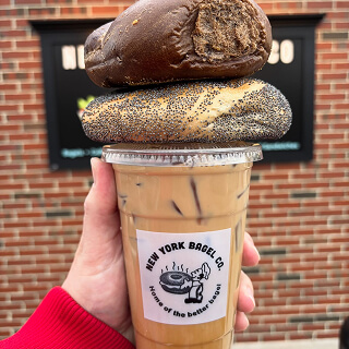 Everything bagel stacked on an NYBC iced coffee