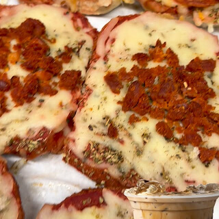 Pizza bagel with melted cheese and pepperoni